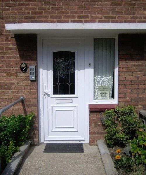 white front door with decorative glazing