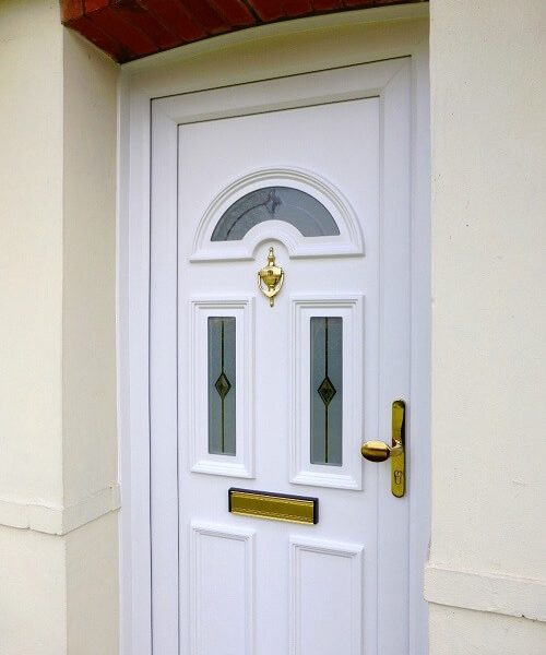 white front door with gold hardware
