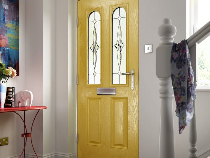 yellow composite door with decorative glazing